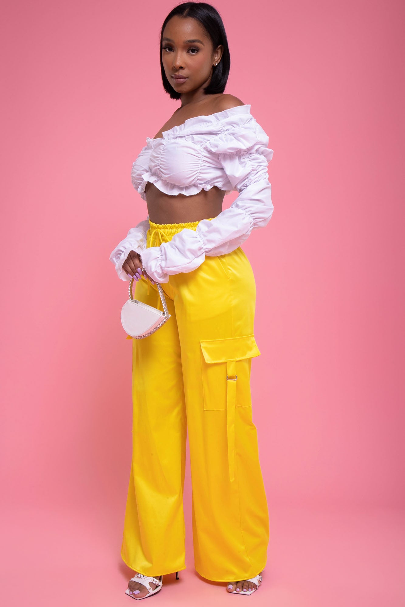 A woman in yellow pants and a white t - shirt photo – Free Shoe Image on  Unsplash